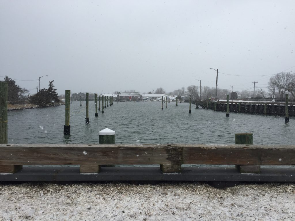 Picture of Barnstable Marina with no docks or boats and a few flakes of snow