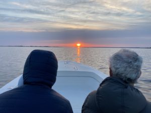 5:30am start as we drive into the sunrise, two heads photographed from behind