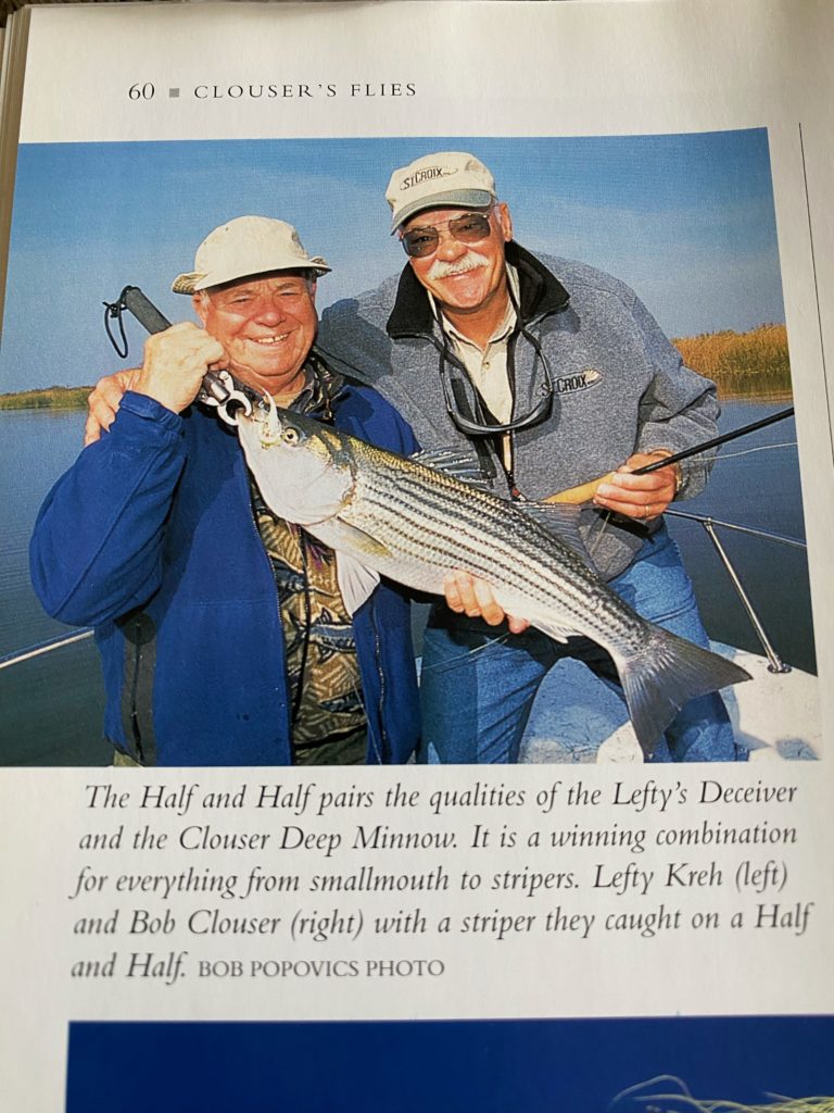 Picture of Left Kreh and Bob Clouse holding a striped bass from the book Clouser's Flies
