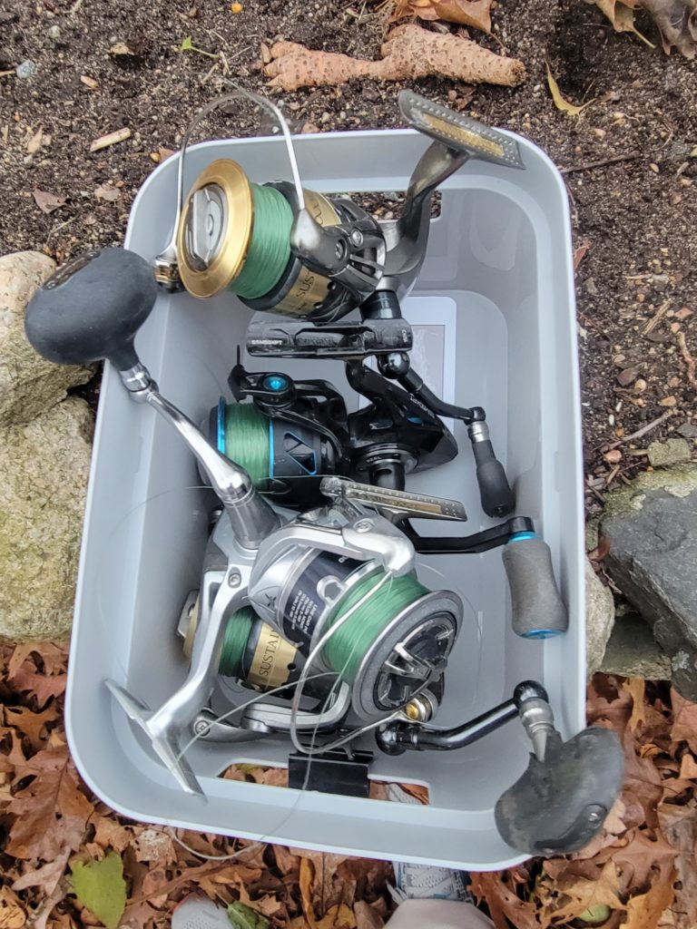 Box filled with saltwater spinning reels in for repair
