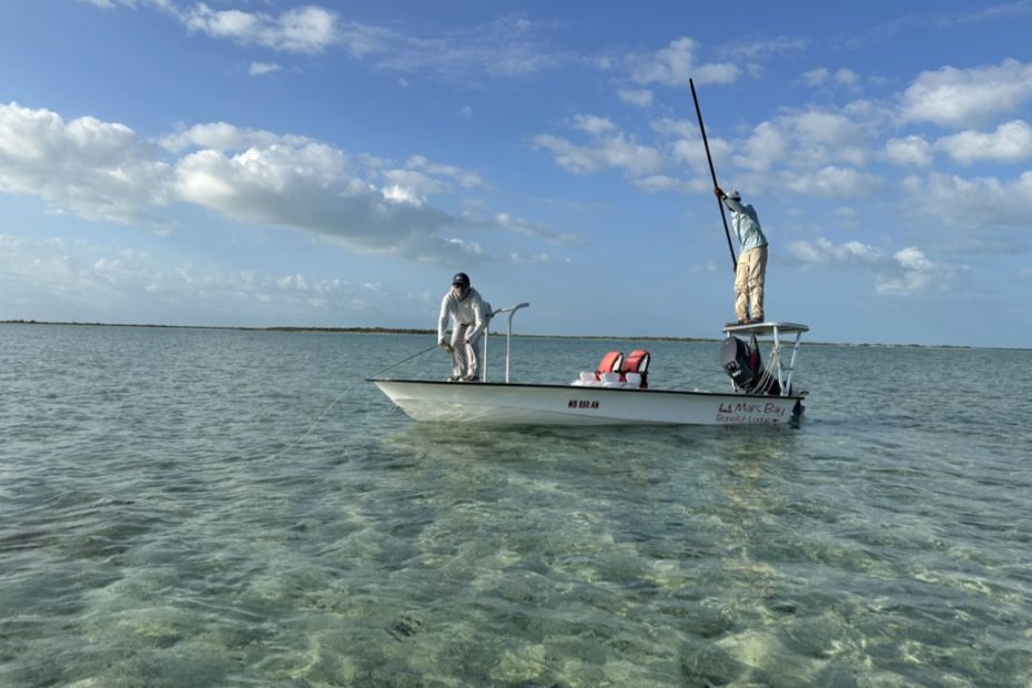 Bonefishing in the Bahamas, guide and angler on a flats boat ready to fish