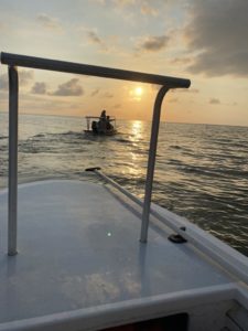 Bahamian Flats boats heading out into a rising sun