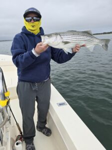 And we are off... Capt. Avery holding a striped bass
